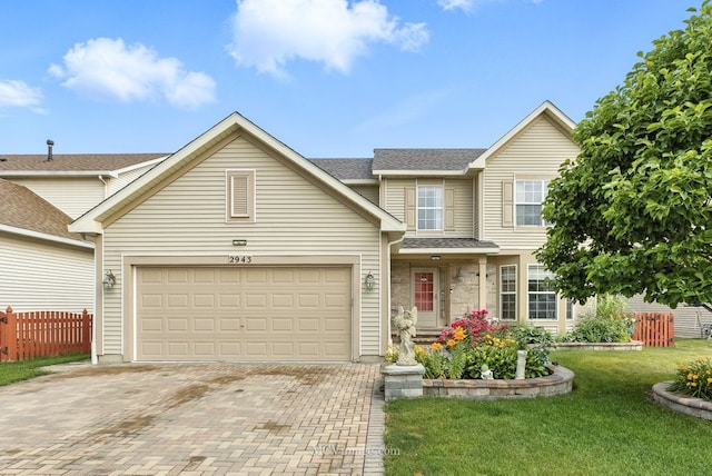 2943 Heather Ln, Montgomery, IL 60538 - traditional-style house with decorative driveway, an attached garage, and roof with shingles