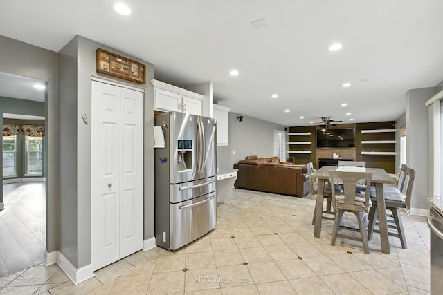 2943 Heather Ln, Montgomery, IL 60538 - kitchen featuring stainless steel fridge, white cabinets, recessed lighting, a ceiling fan, and light tile patterned floors