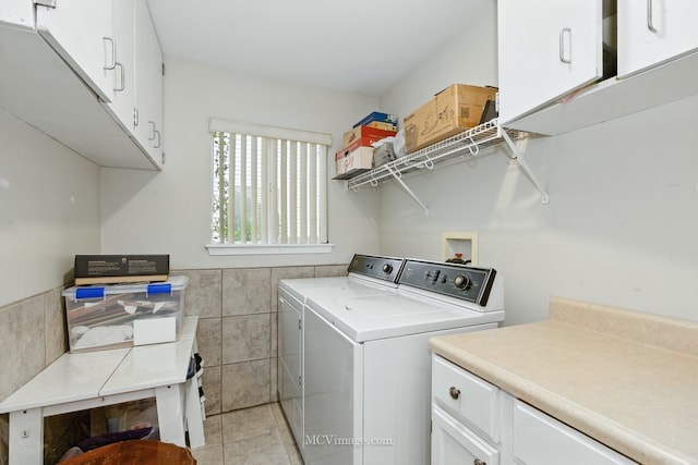 2943 Heather Ln, Montgomery, IL 60538 - washroom featuring independent washer and dryer, tile walls, cabinet space, light tile patterned floors, and wainscoting