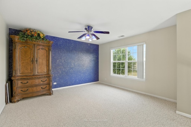 2943 Heather Ln, Montgomery, IL 60538 - spare room featuring light carpet and ceiling fan