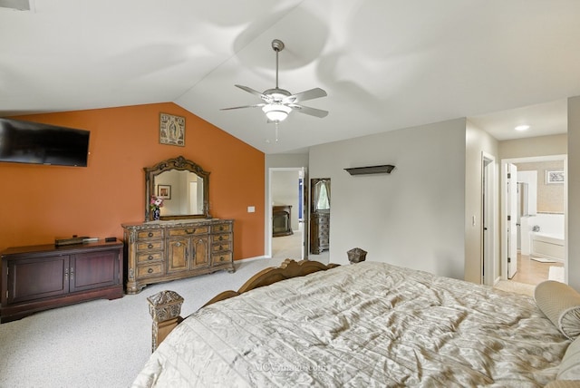 2943 Heather Ln, Montgomery, IL 60538 - carpeted bedroom featuring vaulted ceiling, connected bathroom, and ceiling fan