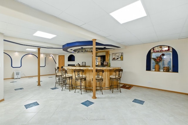 2943 Heather Ln, Montgomery, IL 60538 - indoor wet bar with light tile patterned floors and a drop ceiling