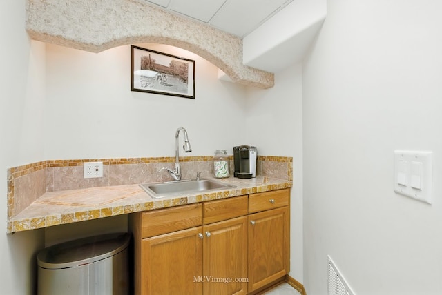 2943 Heather Ln, Montgomery, IL 60538 - kitchen with tile countertops and brown cabinetry