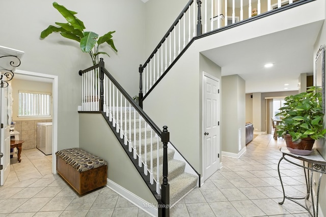 2943 Heather Ln, Montgomery, IL 60538 - staircase featuring tile patterned flooring and a high ceiling