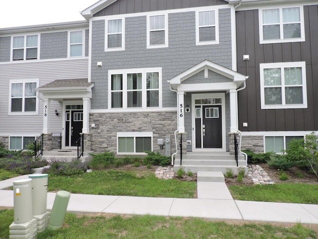 516 Wolverine Dr, Aurora, IL 60502 - townhome / multi-family property featuring stone siding and board and batten siding