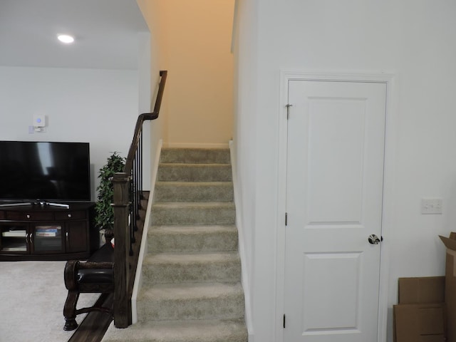 516 Wolverine Dr, Aurora, IL 60502 - staircase with arched walkways and carpet flooring