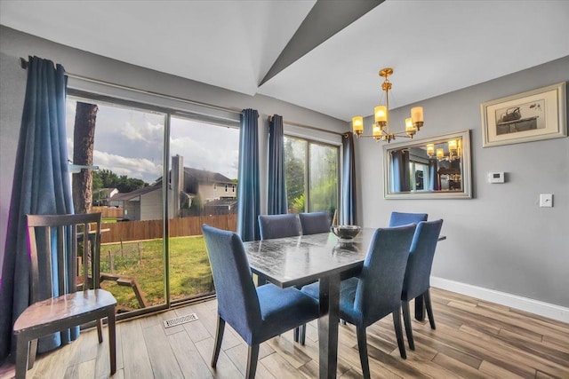 724 Colorado Ct Unit 724, Carol Stream, IL 60188 - dining room featuring a chandelier and wood finished floors