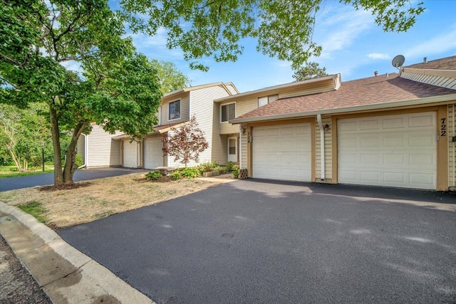 724 Colorado Ct Unit 724, Carol Stream, IL 60188 - multi unit property featuring a shingled roof and a garage