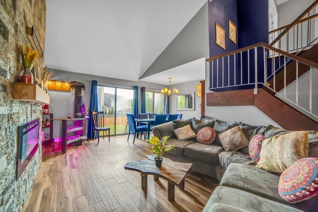 724 Colorado Ct Unit 724, Carol Stream, IL 60188 - living area featuring a chandelier, wood finished floors, stairway, and high vaulted ceiling