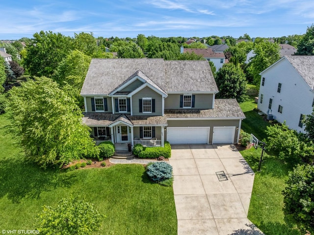 2865 Trail Crest Ln, Lindenhurst, IL 60046 - traditional-style home featuring covered porch, concrete driveway, and an attached garage