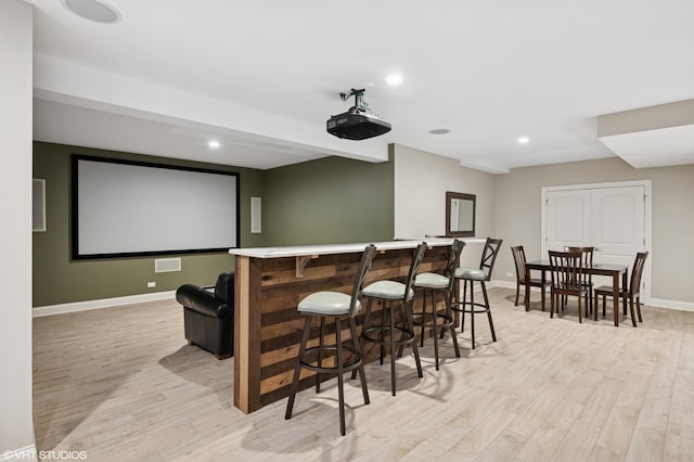 2865 Trail Crest Ln, Lindenhurst, IL 60046 - home theater room with light wood-style flooring, a dry bar, and recessed lighting