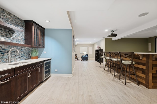 2865 Trail Crest Ln, Lindenhurst, IL 60046 - indoor bar with beverage cooler, light wood-style floors, tasteful backsplash, and recessed lighting
