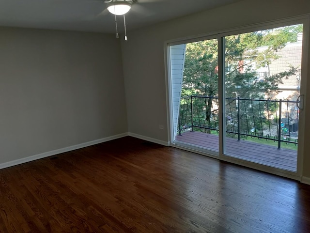 19 Cour Saint Tropez Ct Unit 19, Palos Hills, IL 60465 - spare room featuring dark wood-style flooring and ceiling fan