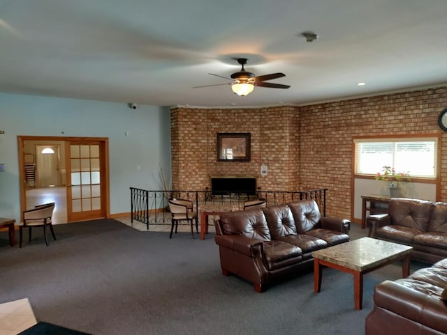 19 Cour Saint Tropez Ct Unit 19, Palos Hills, IL 60465 - carpeted living area with a ceiling fan, a fireplace, and brick wall