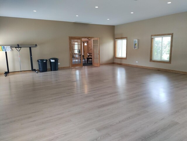 19 Cour Saint Tropez Ct Unit 19, Palos Hills, IL 60465 - unfurnished living room featuring light wood-style flooring, recessed lighting, and french doors