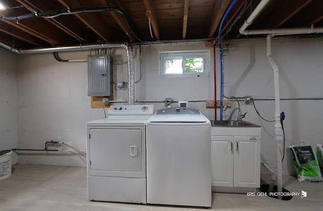 5505 Oak Park Rd, Cary, IL 60013 - washroom featuring electric panel, washing machine and dryer, and cabinet space
