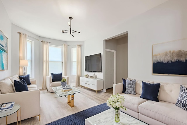 5359 S Marshfield Ave, Chicago, IL 60609 - living area with a chandelier and light wood-style flooring