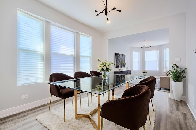 5359 S Marshfield Ave, Chicago, IL 60609 - dining area featuring a chandelier and light wood-style floors