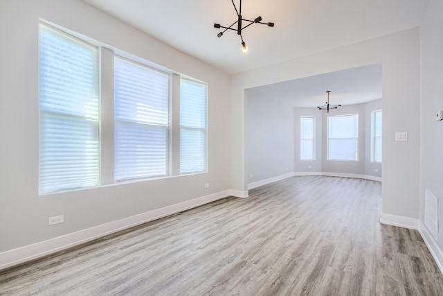5359 S Marshfield Ave, Chicago, IL 60609 - spare room with a chandelier and wood finished floors