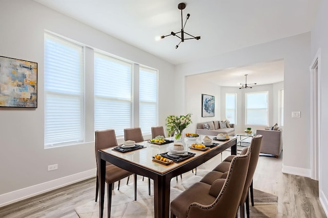5359 S Marshfield Ave, Chicago, IL 60609 - dining area with a chandelier and light wood-type flooring