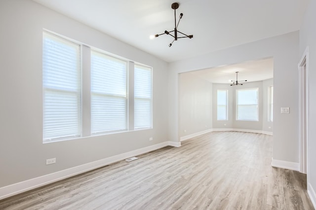 5359 S Marshfield Ave, Chicago, IL 60609 - empty room featuring a chandelier and light wood-type flooring