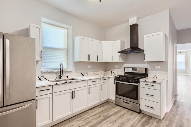 5359 S Marshfield Ave, Chicago, IL 60609 - kitchen featuring stainless steel appliances, wall chimney exhaust hood, white cabinetry, and light wood-style flooring