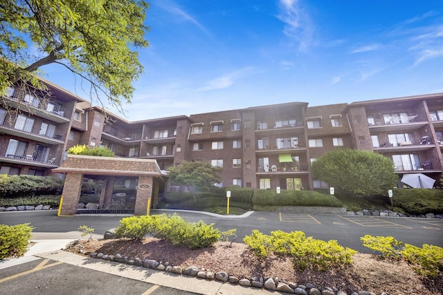101 Old Oak Dr Unit 400A, Buffalo Grove, IL 60089 - view of apartment building / complex featuring uncovered parking