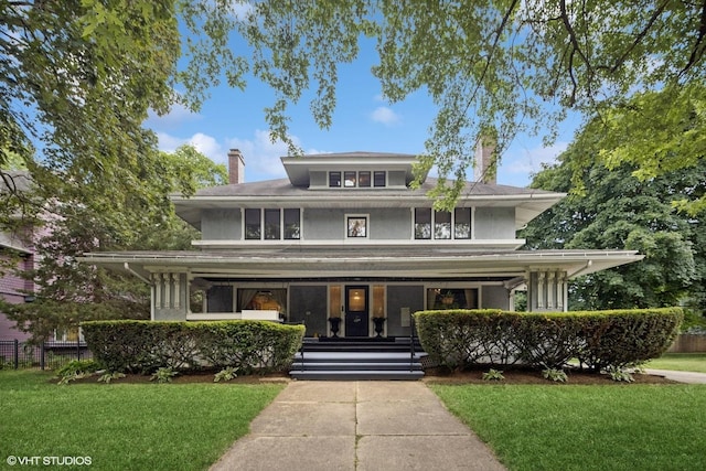 710 W Downer Pl, Aurora, IL 60506 - traditional style home with a chimney and a porch