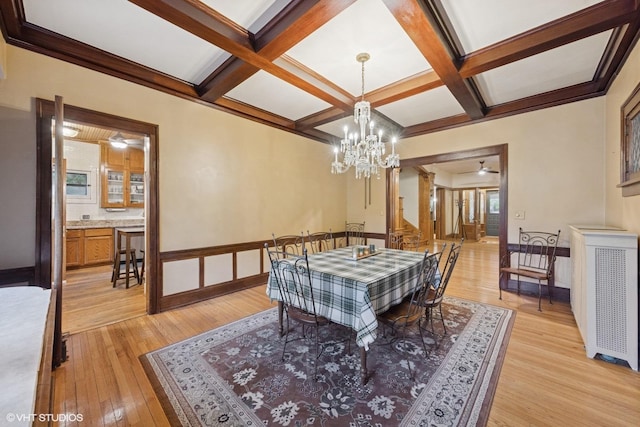 710 W Downer Pl, Aurora, IL 60506 - dining room with light wood-style flooring, coffered ceiling, beamed ceiling, and a chandelier