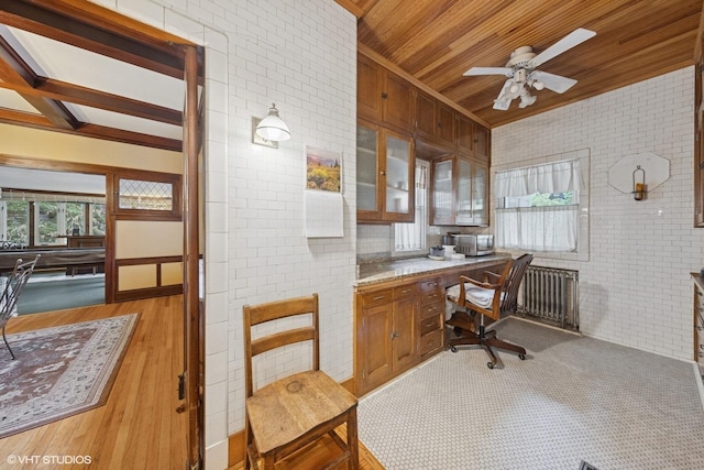 710 W Downer Pl, Aurora, IL 60506 - office with plenty of natural light, built in desk, a ceiling fan, brick wall, and wood finished floors