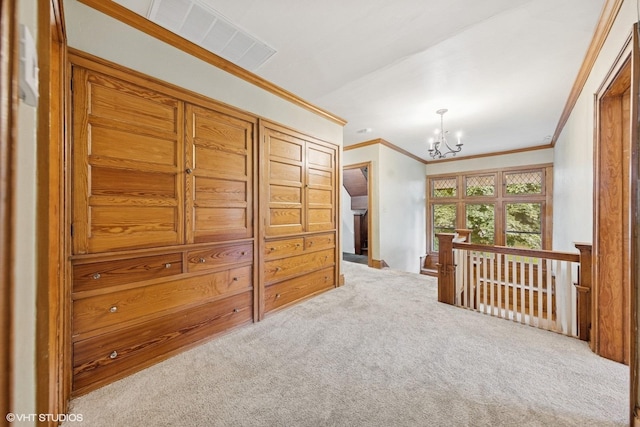710 W Downer Pl, Aurora, IL 60506 - hallway featuring ornamental molding, a chandelier, carpet floors, and an upstairs landing