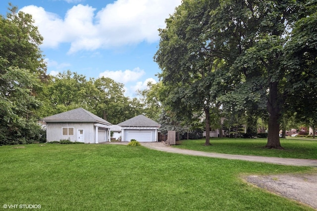 710 W Downer Pl, Aurora, IL 60506 - view of front facade featuring a garage and a front yard