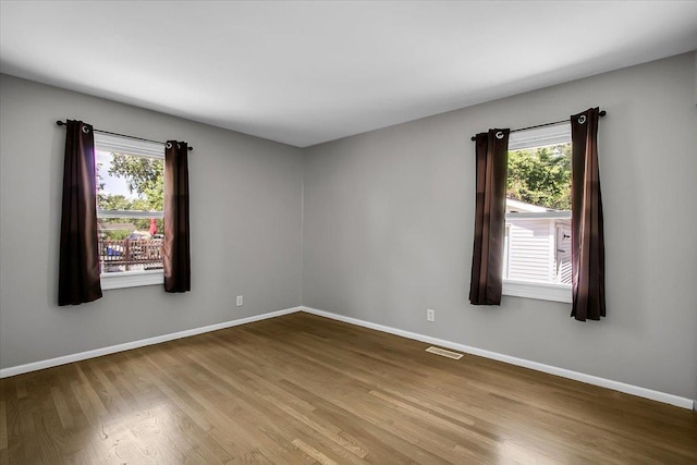 22255 Merrill Ave, Sauk Village, IL 60411 - empty room featuring wood finished floors and baseboards