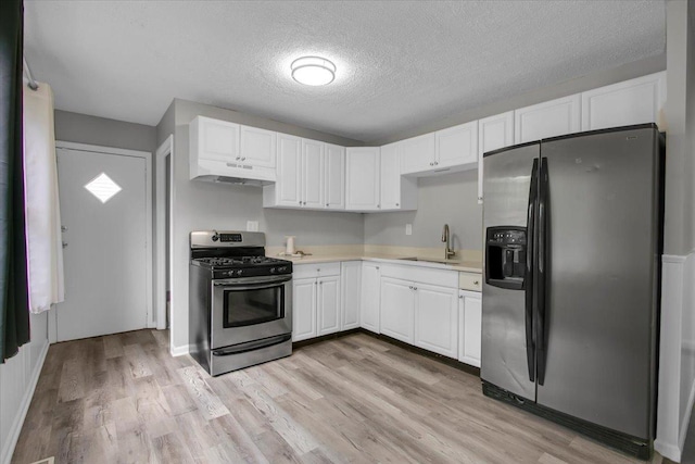 22255 Merrill Ave, Sauk Village, IL 60411 - kitchen featuring stainless steel appliances, under cabinet range hood, light countertops, white cabinets, and light wood-type flooring