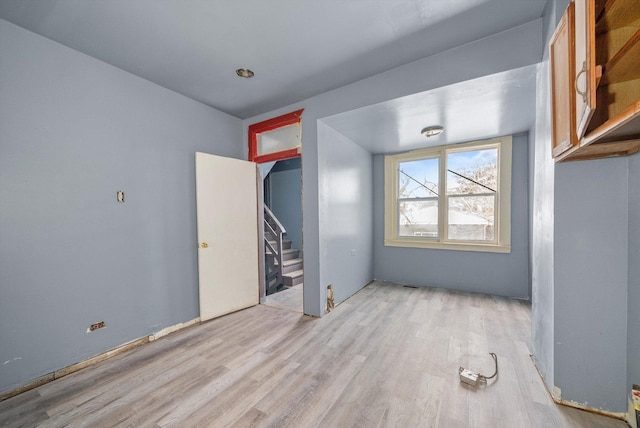8545 S Saginaw Ave, Chicago, IL 60617 - empty room with wood finished floors and stairs