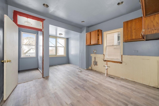 8545 S Saginaw Ave, Chicago, IL 60617 - kitchen with light wood-type flooring and brown cabinetry