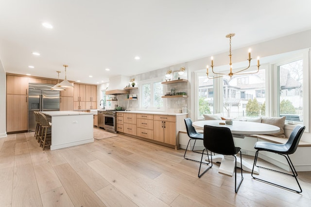 438 Hill Ave, Glen Ellyn, IL 60137 - kitchen featuring premium appliances, light brown cabinetry, custom range hood, open shelves, and recessed lighting
