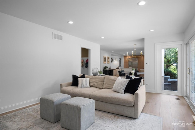 438 Hill Ave, Glen Ellyn, IL 60137 - living area featuring light wood-type flooring, recessed lighting, and a chandelier