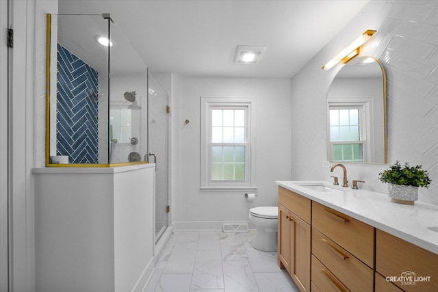 438 Hill Ave, Glen Ellyn, IL 60137 - bathroom with marble look tile flooring, double vanity, and a stall shower