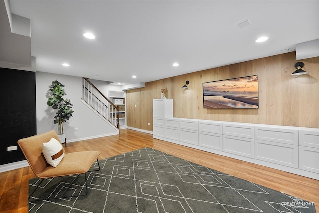 438 Hill Ave, Glen Ellyn, IL 60137 - sitting room with light wood-style flooring, recessed lighting, stairway, and wood walls