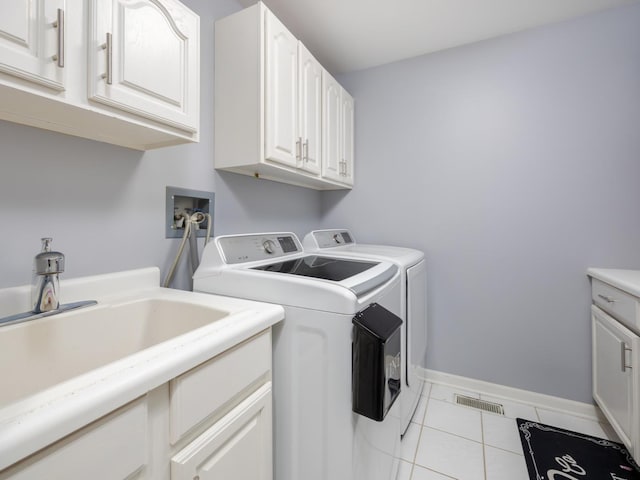 1213 Prairie Ave, Barrington, IL 60010 - laundry room featuring washer and dryer, tile patterned floors, and cabinet space