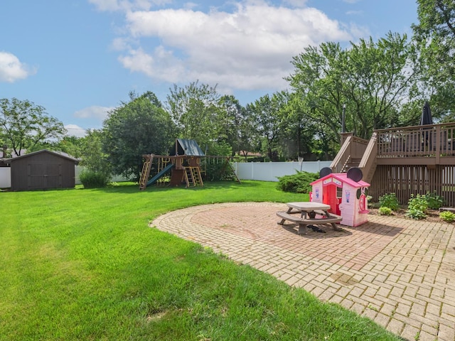 1213 Prairie Ave, Barrington, IL 60010 - fenced backyard with a patio, a playground, a wooden deck, stairs, and a shed