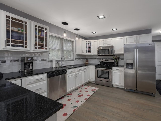 1213 Prairie Ave, Barrington, IL 60010 - kitchen featuring stainless steel appliances, decorative backsplash, and white cabinetry