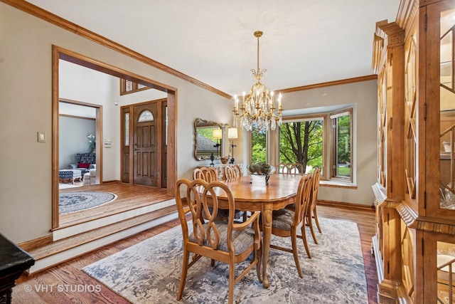 3104 Royal Fox Dr, Saint Charles, IL 60174 - dining room with light wood finished floors, a chandelier, and ornamental molding