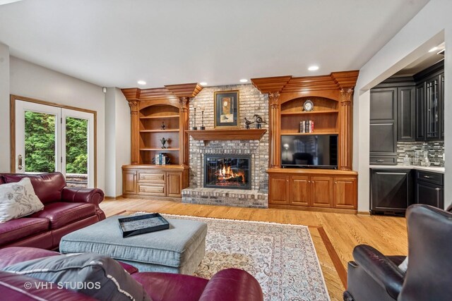 3104 Royal Fox Dr, Saint Charles, IL 60174 - living room featuring light wood-type flooring, a brick fireplace, and recessed lighting