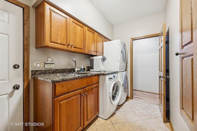 3104 Royal Fox Dr, Saint Charles, IL 60174 - laundry room featuring cabinet space, stacked washer and clothes dryer, and light tile patterned floors