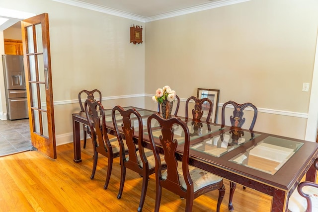 1702 E State St, Rockford, IL 61104 - dining area with ornamental molding and light wood-style floors