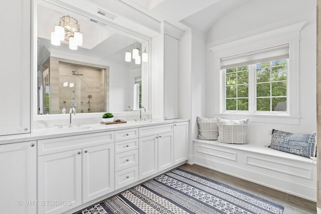1200 Green Bay Rd, Glencoe, IL 60022 - bathroom featuring a shower stall, double vanity, wood finished floors, and lofted ceiling