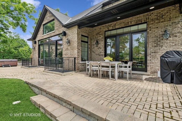 1200 Green Bay Rd, Glencoe, IL 60022 - view of patio featuring a hot tub, grilling area, and outdoor dining space