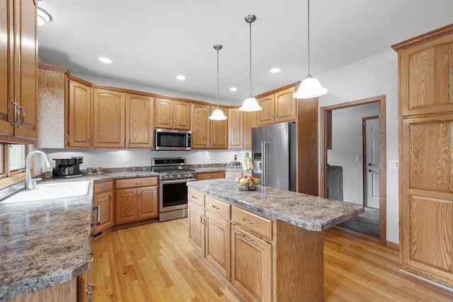 2717 Meadow Path, New Lenox, IL 60451 - kitchen featuring appliances with stainless steel finishes, a kitchen island, light wood-type flooring, recessed lighting, and decorative light fixtures